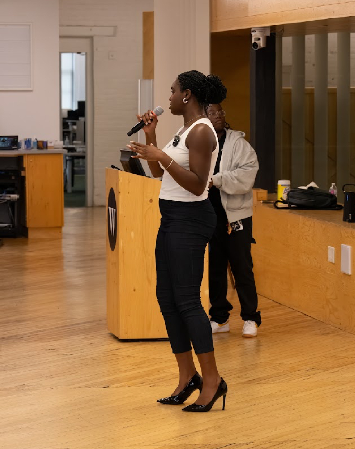 Feyisayo Enuiyin speaking on stage