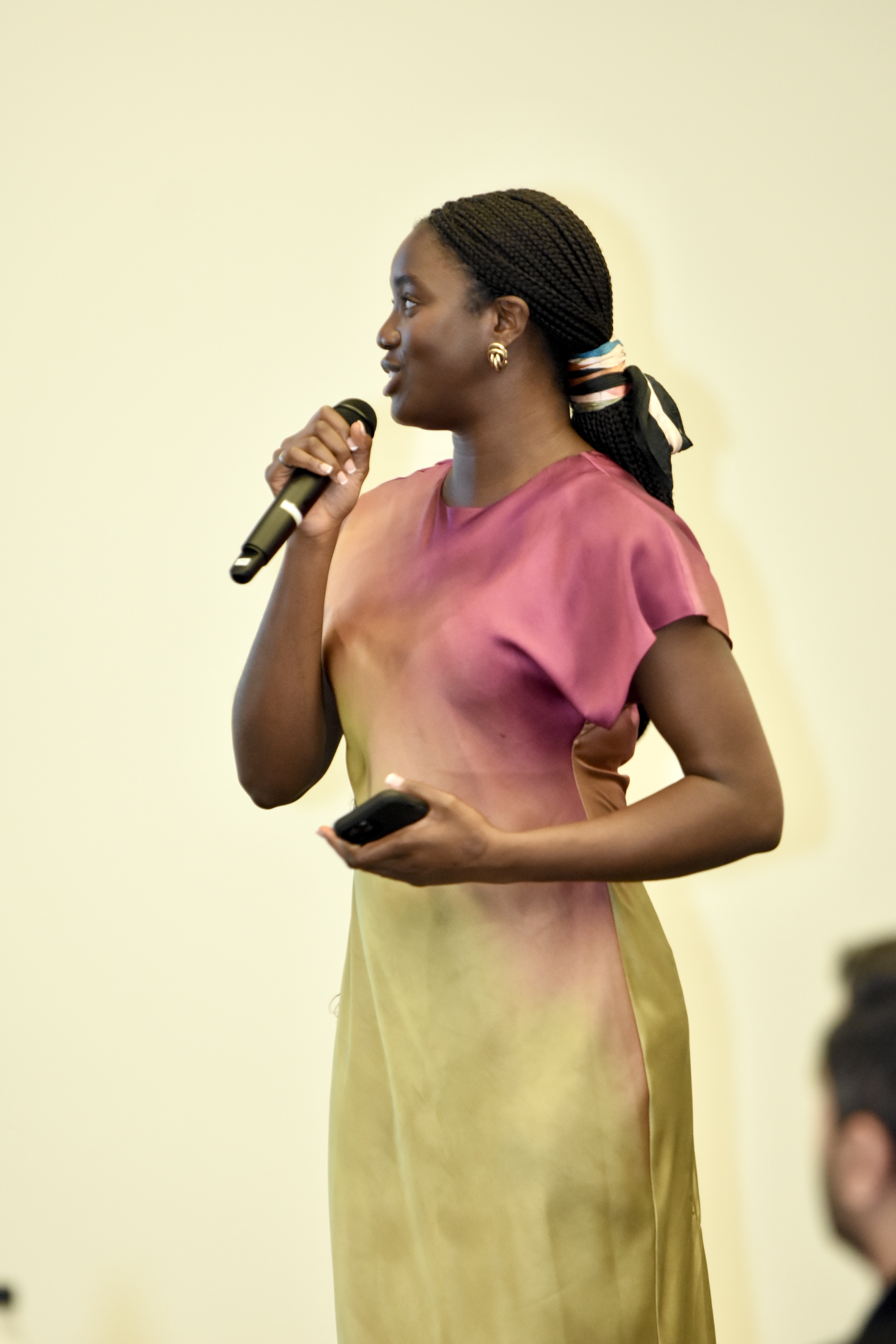 Feyisayo Enuiyin speaking on stage